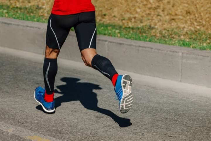 man running with compression socks