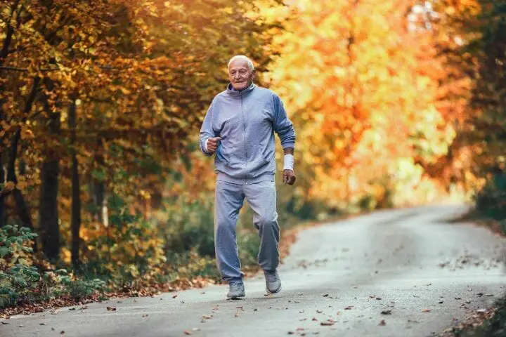 senior man running in a park