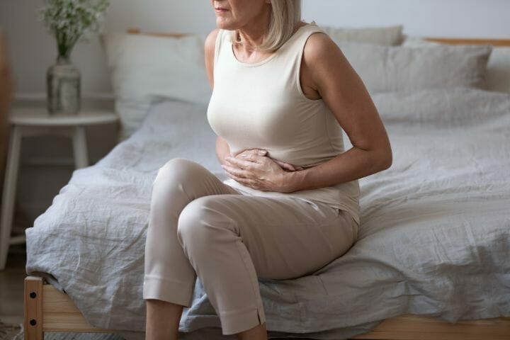 Mature woman feeling nauseous