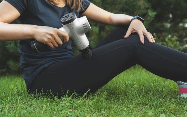 Woman using a percussion massager