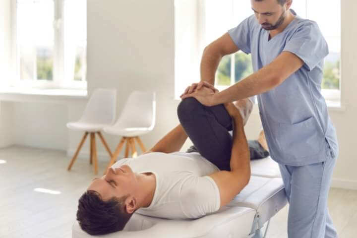 chiropractor with patient