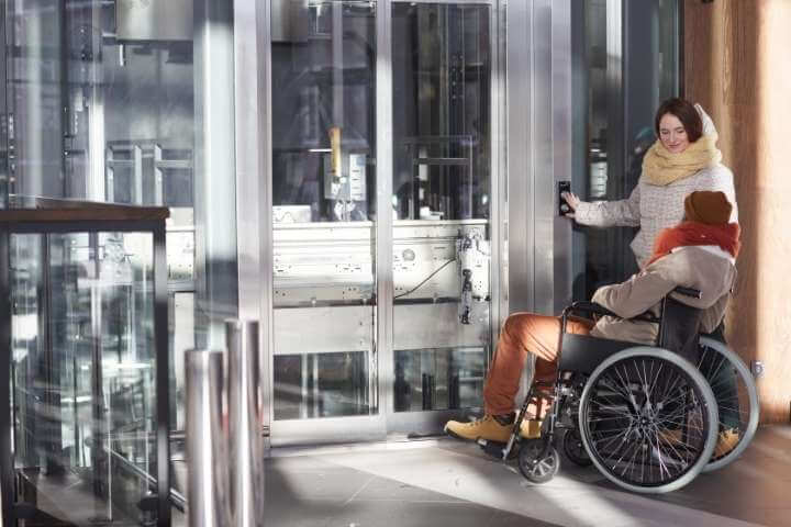 disabled man using elevator
