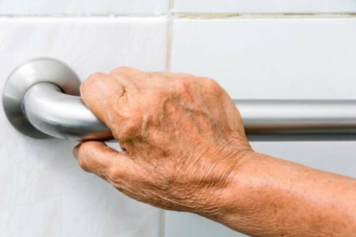 elderly using hand bar