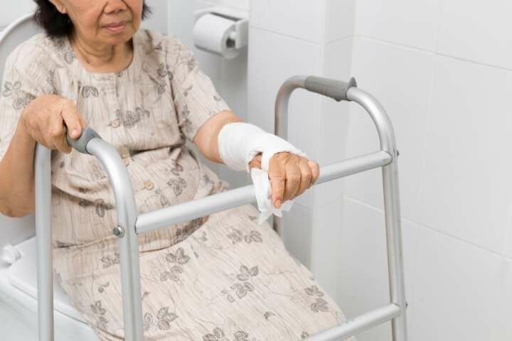 elderly woman using bathroom