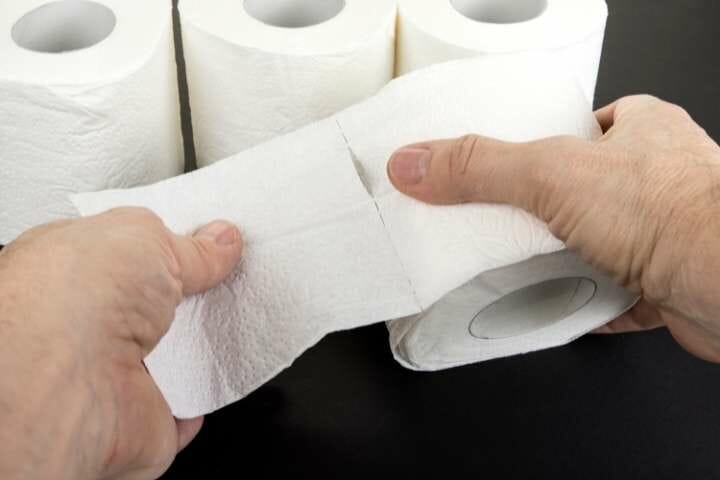 tearing toilet paper