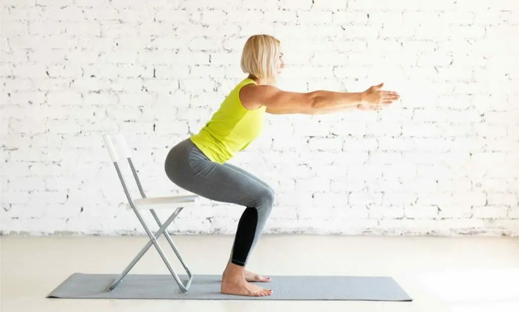 Woman doing chair squats