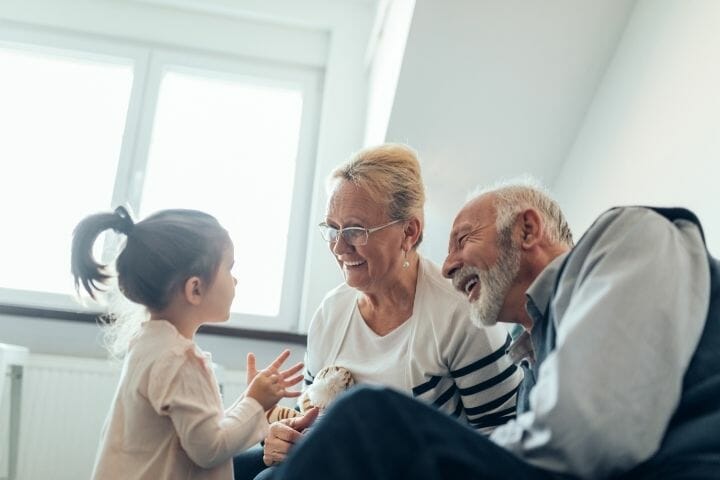 grandparents with their granddaughter