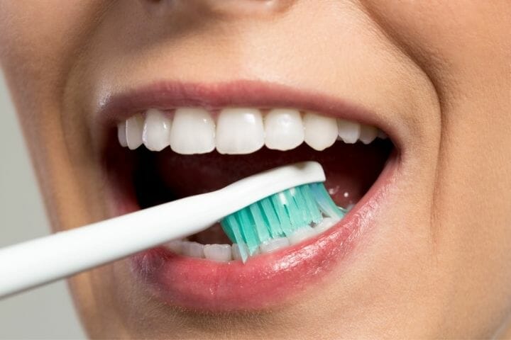 girl brushing her teeth