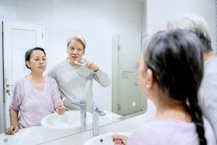 senior couple brushing together