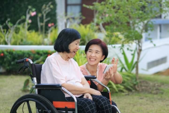 happy old woman and daughter