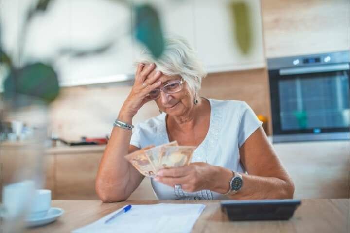 elderly counting her money