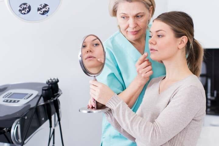 woman consulting on cosmetologist